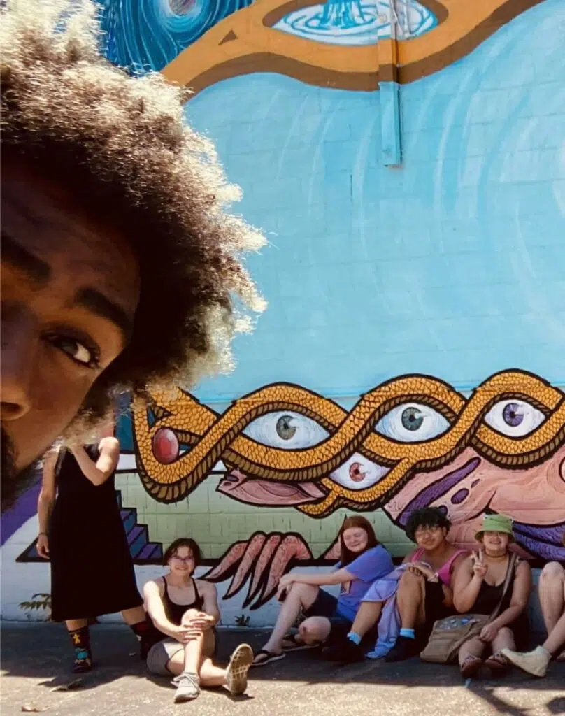 Hanging out in front of a mural