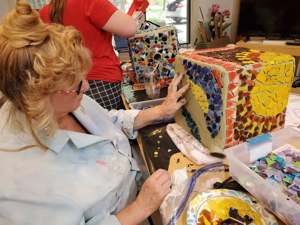 Artist working on mosaic